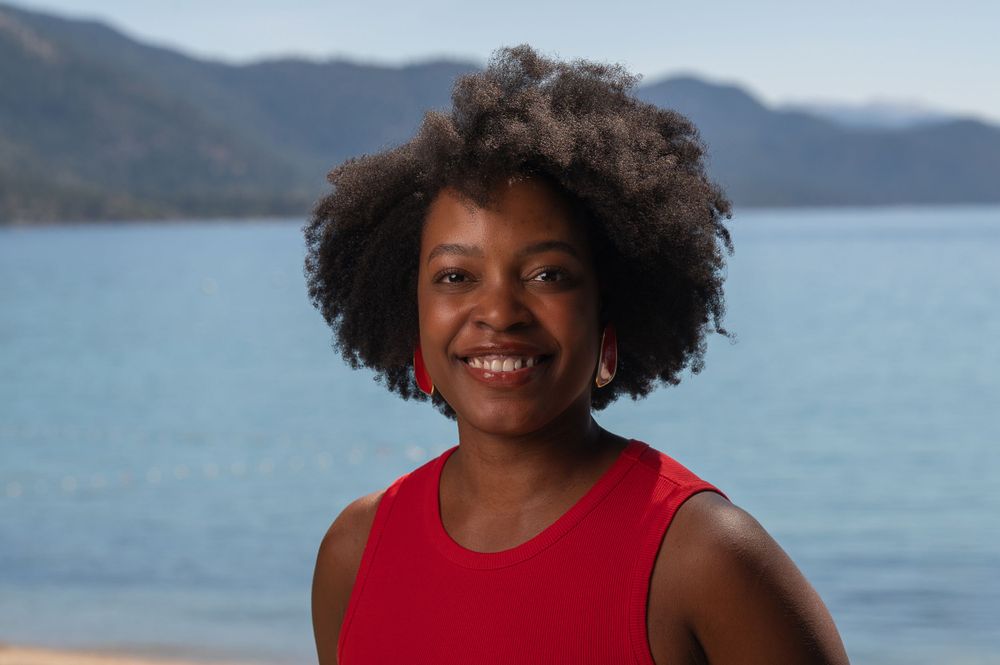 Horizontal headshot of an African American woman with the mountains and Lake Tahoe Nevada as the background