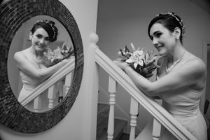 Black and white wedding portraits captured with artistic framing and natural light.