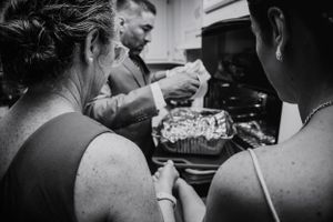 Black and white candid shots capturing pre-wedding moments and preparations.