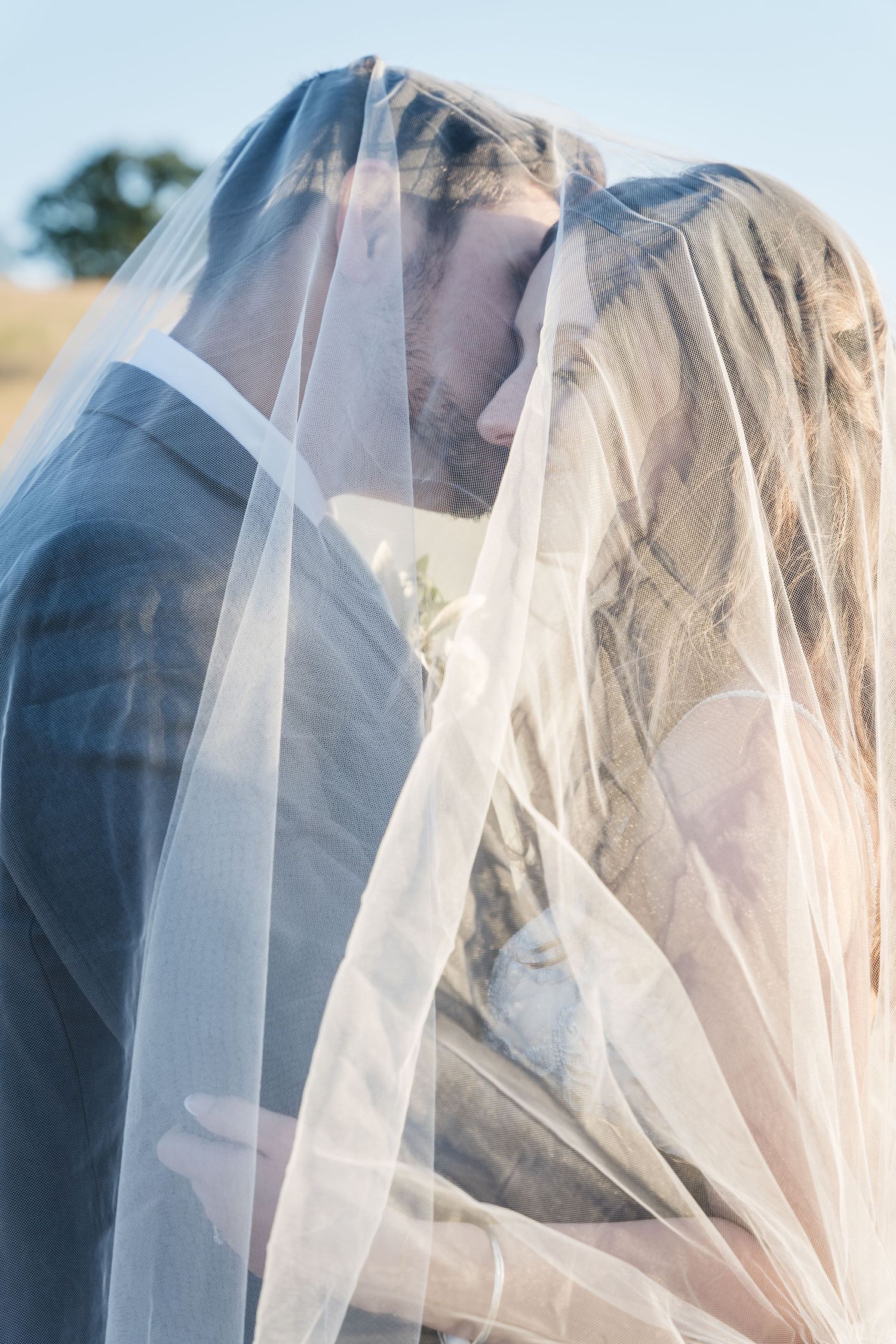 Golden hour wedding portrait taken at the Spanish R Ranch in Angels Camp, CA. Photo taken by Northern California Wedding Photographer.