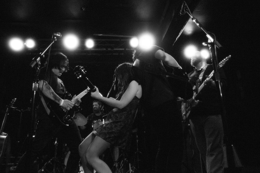 Dramatic Black and white band photo during live music performance in Baltimore Maryland.