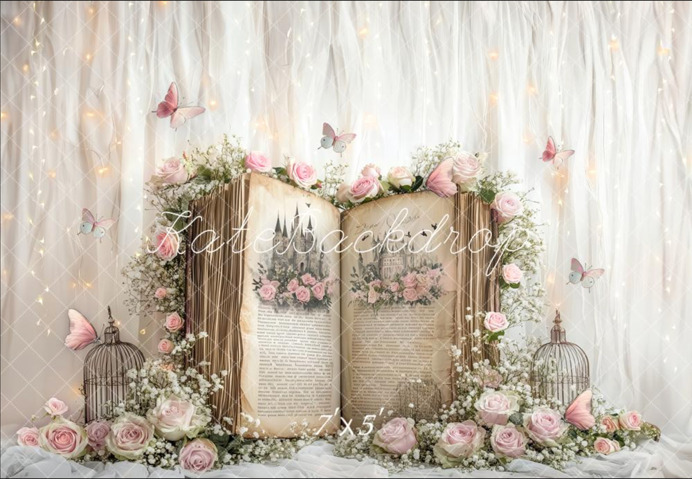 Vintage birdcages decorated with pink roses and butterflies against a rustic white wall create a romantic shabby chic display.