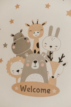 Cute nursery wall art featuring cartoon animals with 'Welcome' text in neutral colors.
