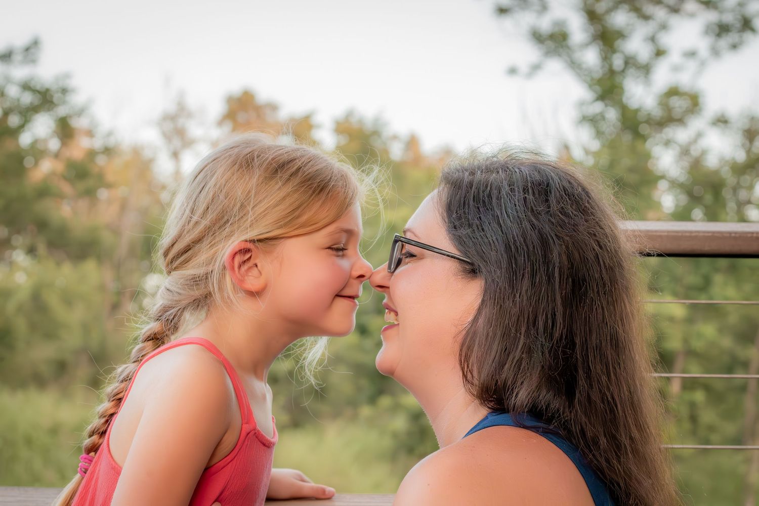 Two people sharing a joyful moment together outdoors.