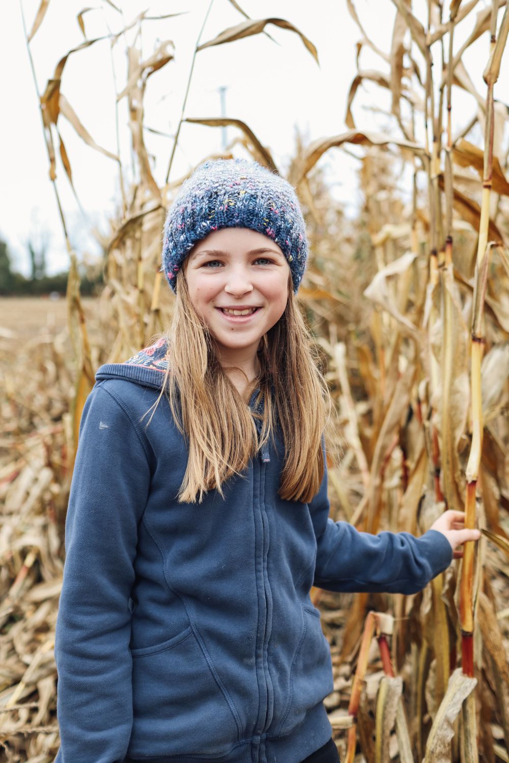 Beautiful girl in the crops with autumnal colours