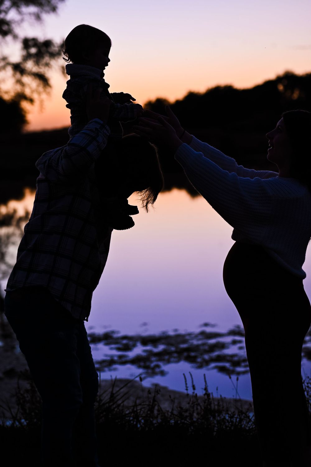 Family maternity photo session at sunset.