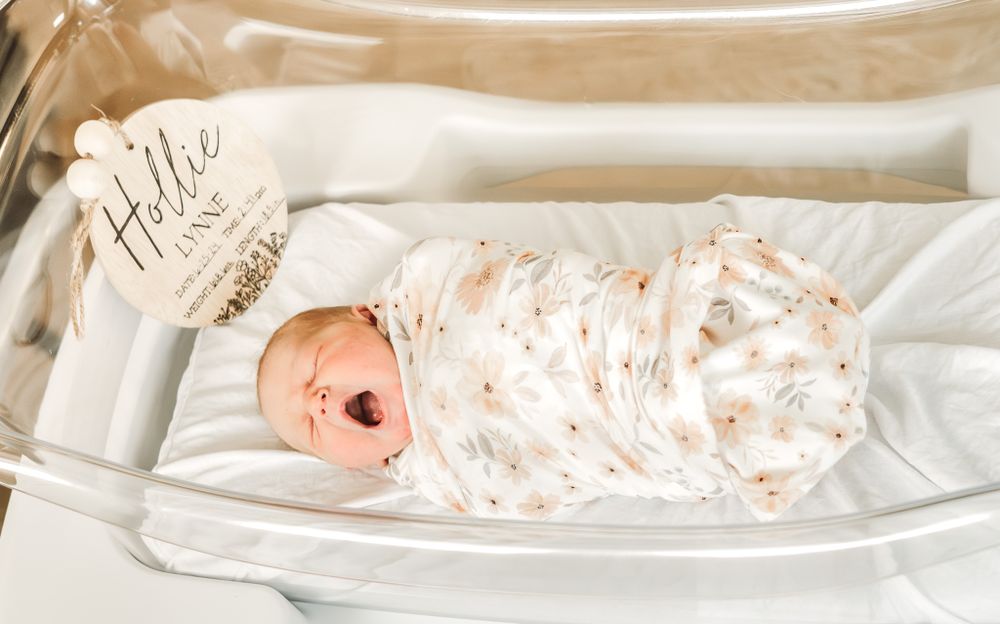 Newborn yawn in hospital bassinet