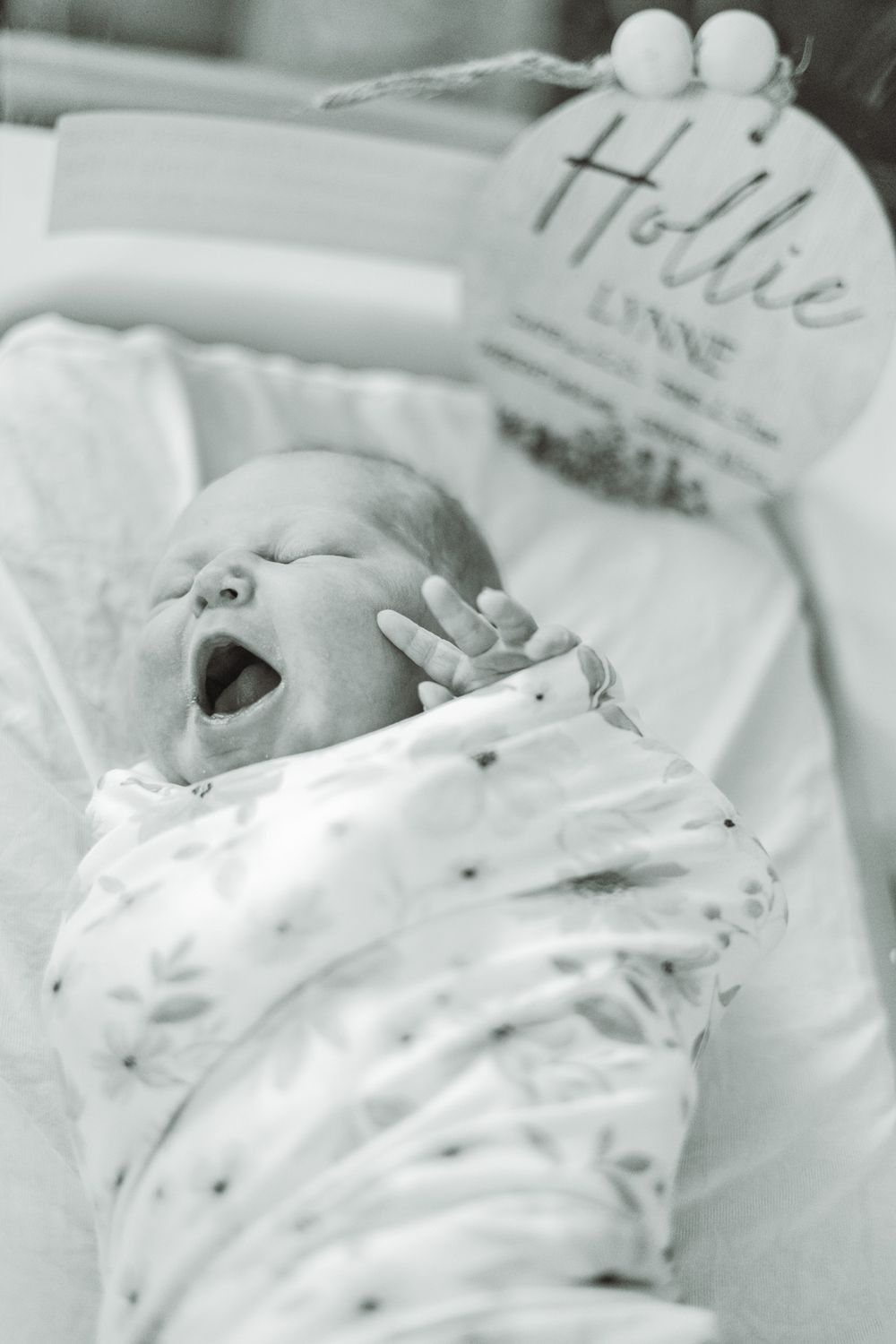 Newborn in hospital bassinet by Memorari Portrait