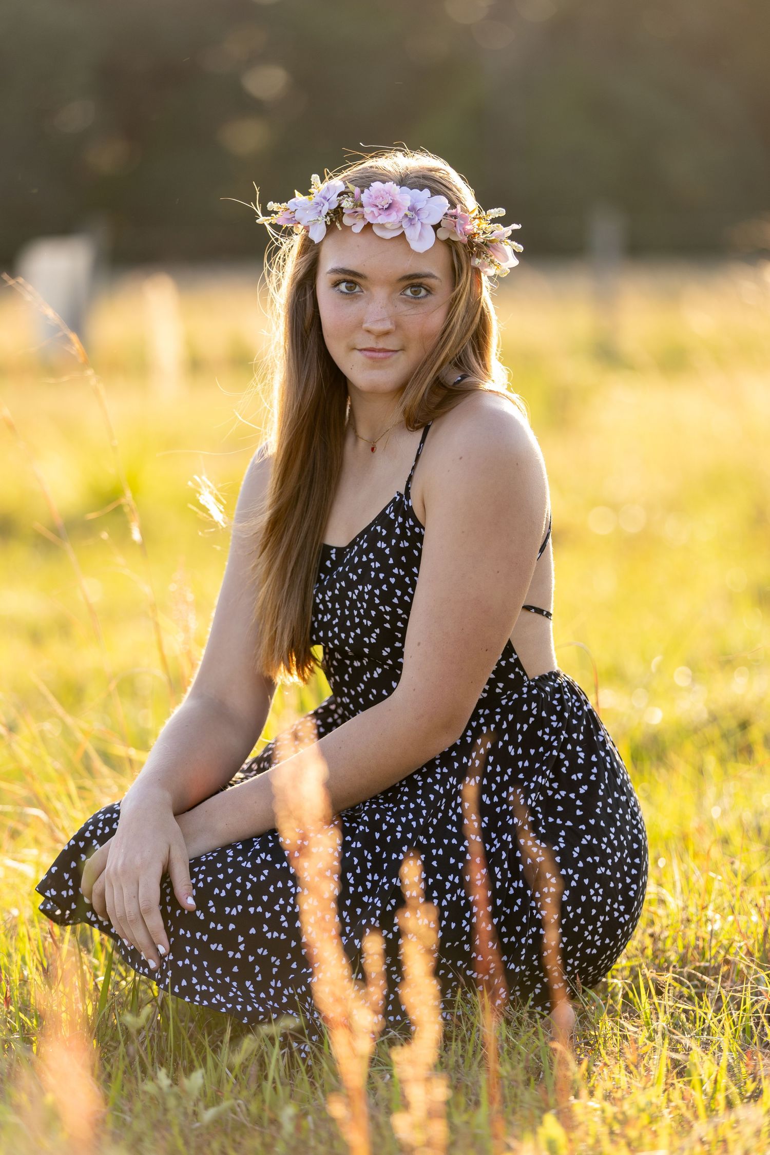 Outdoor portrait in a summer field with floral crown and polka dot dress.  Geneva, Florida