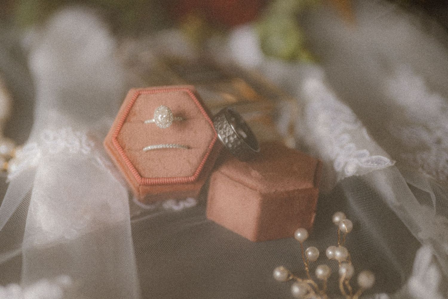 Close-up of vintage style pink geometric ring boxes with soft focus. Oklahoma Wedding Photographer