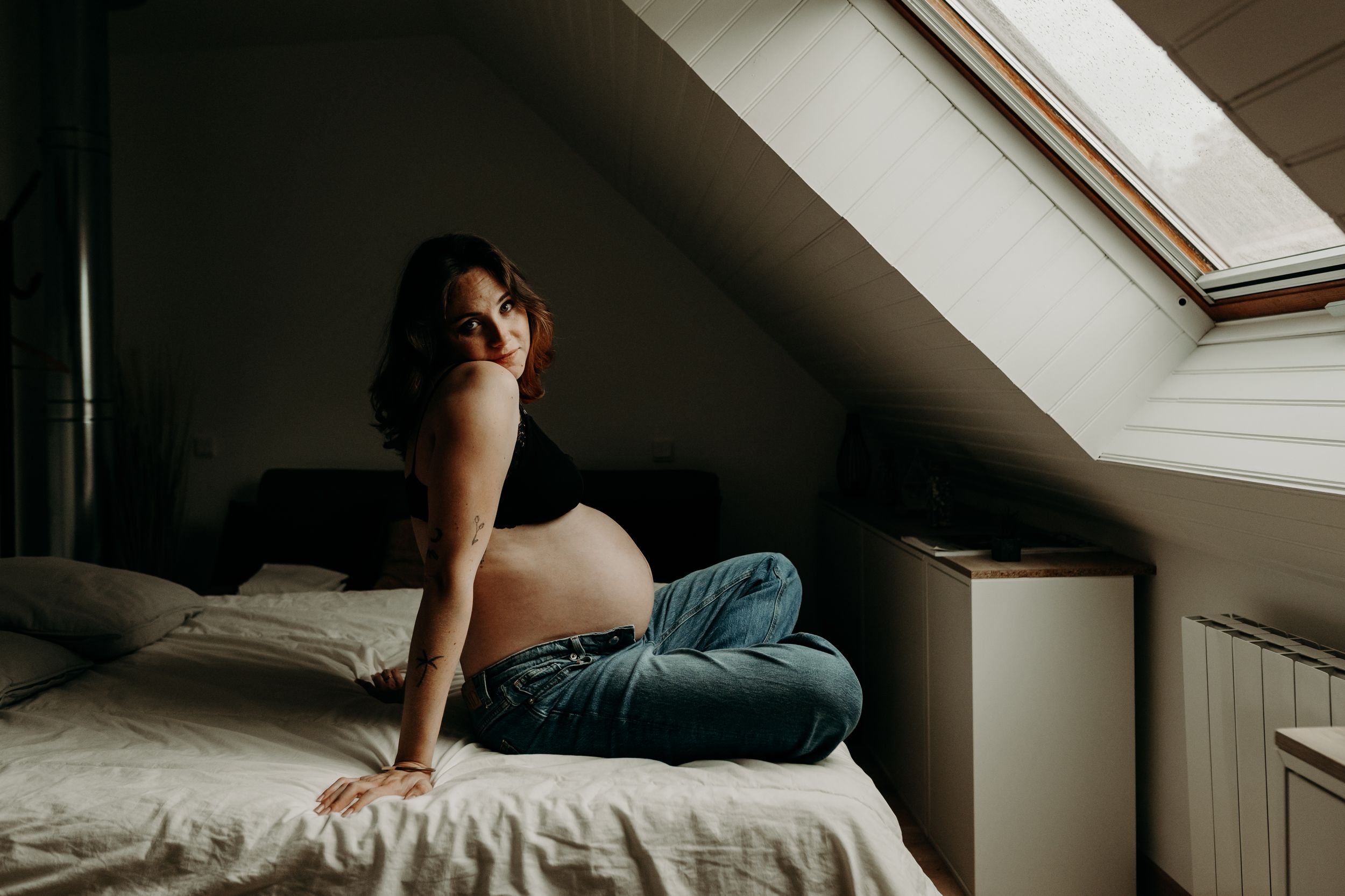 A series of photos showing someone sleeping in different positions under natural light from a skylight window.