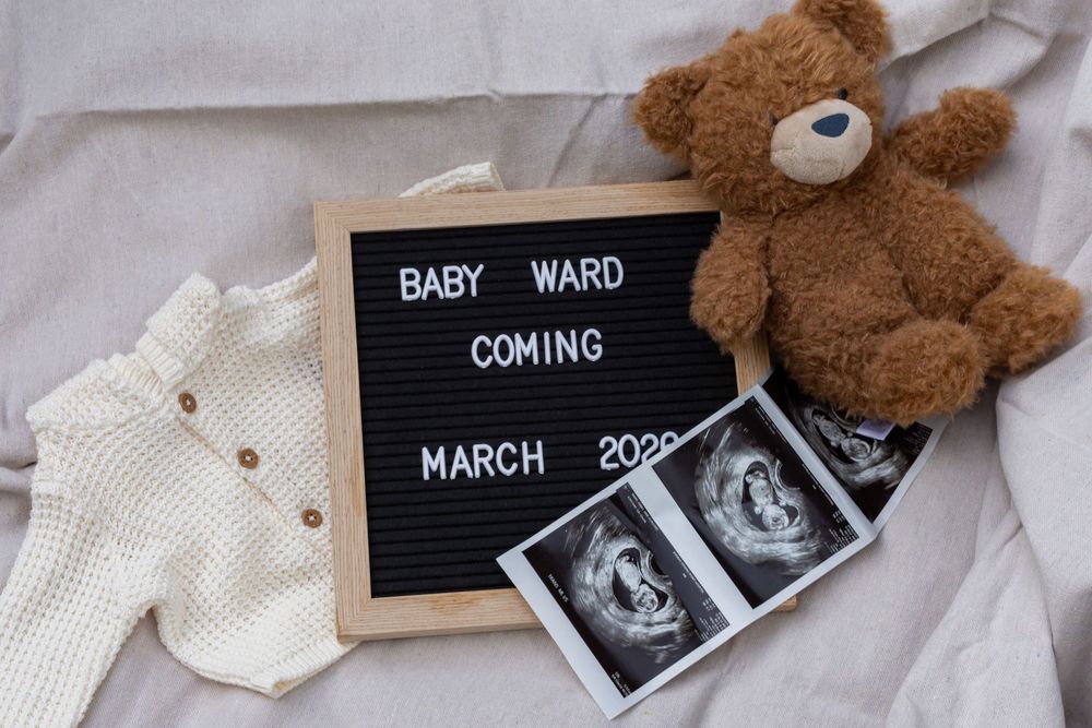 Pregnancy announcement collage featuring ultrasound photos, teddy bear, and letter board displaying March 2023 due date.