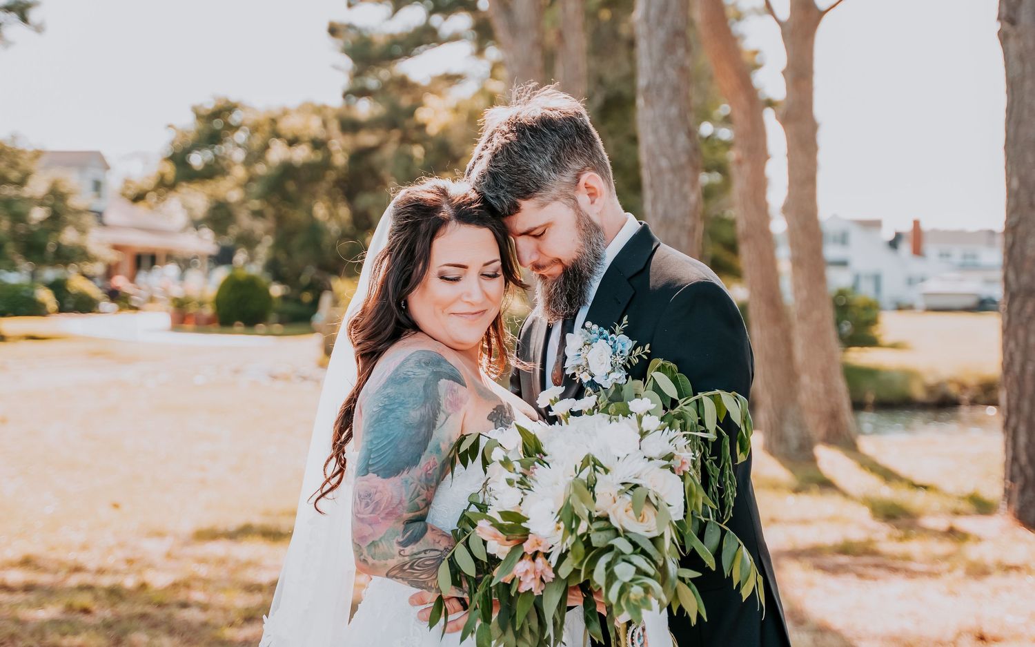 A romantic wedding photo series capturing tender moments between a couple in a scenic outdoor setting at sunset.