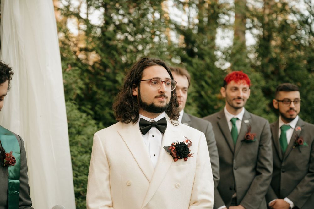 Elegant wedding ceremony with groomsmen in formal attire.