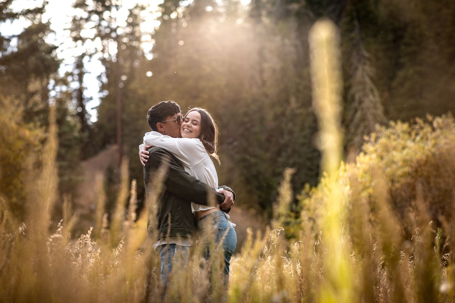 Beautiful outdoor engagement photography; couple in sunset landscape
