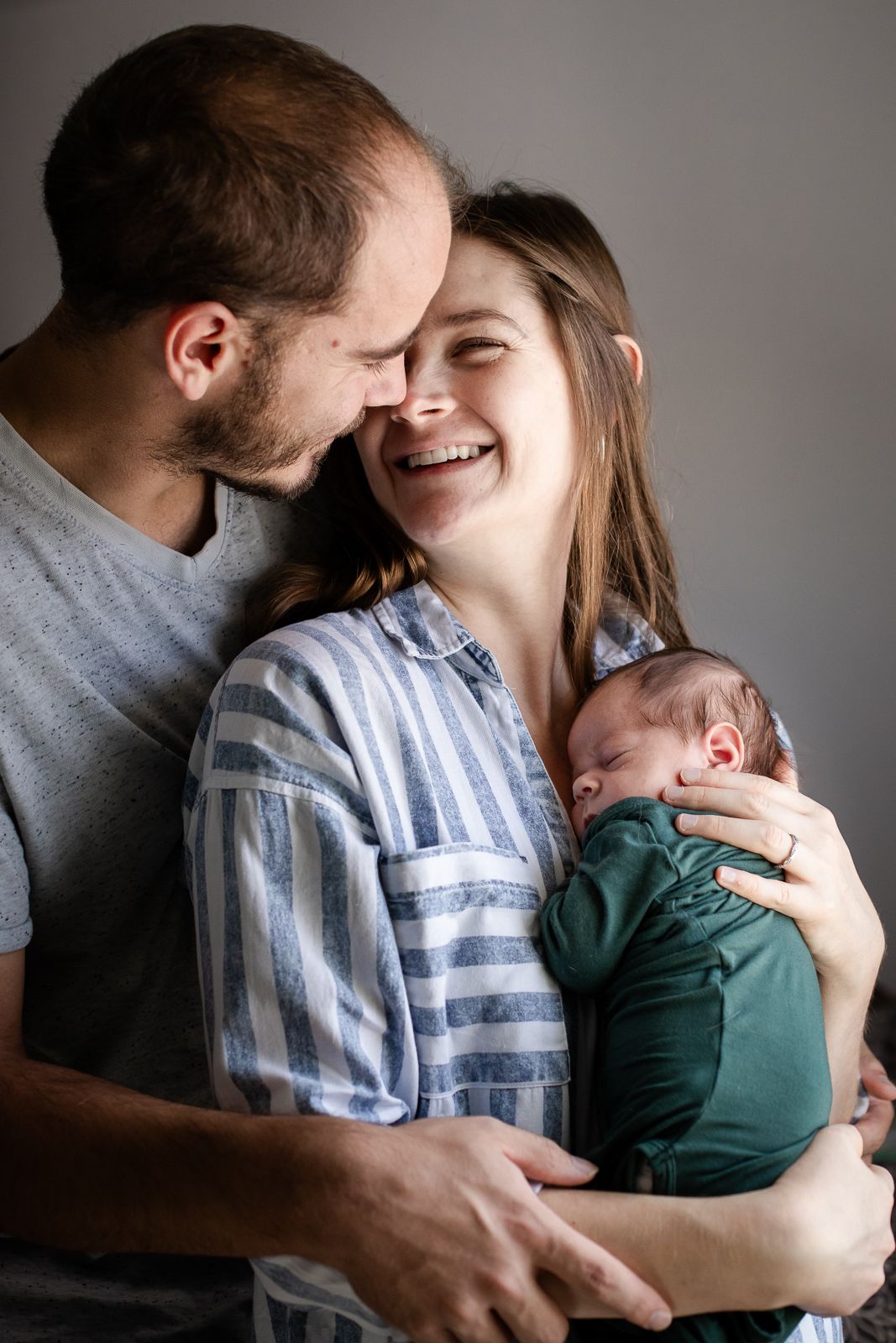 Beautiful lifestyle newborn photography; couple with newborn baby; Clarissa Anello