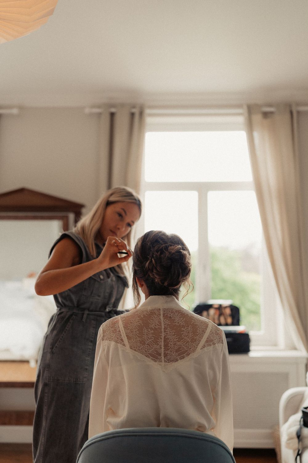 Styling session by a bright window in a minimalist room.