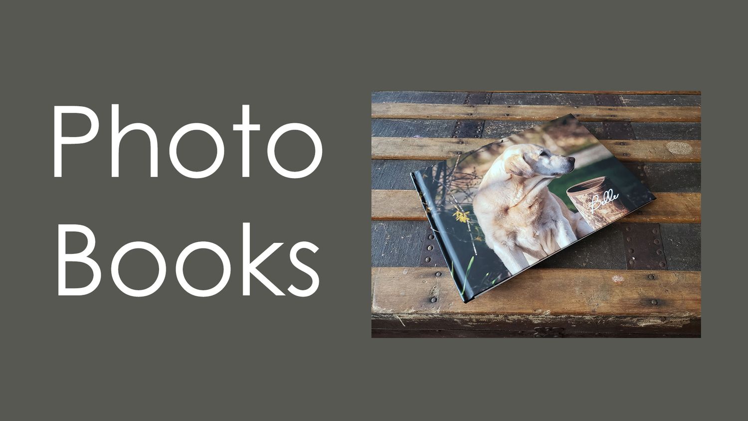 Open photo book with images displayed on rustic wooden surface.