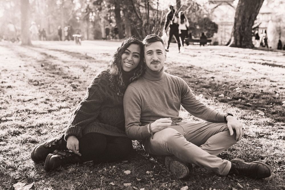 Natural lifestyle photography session in a park with soft autumn lighting.