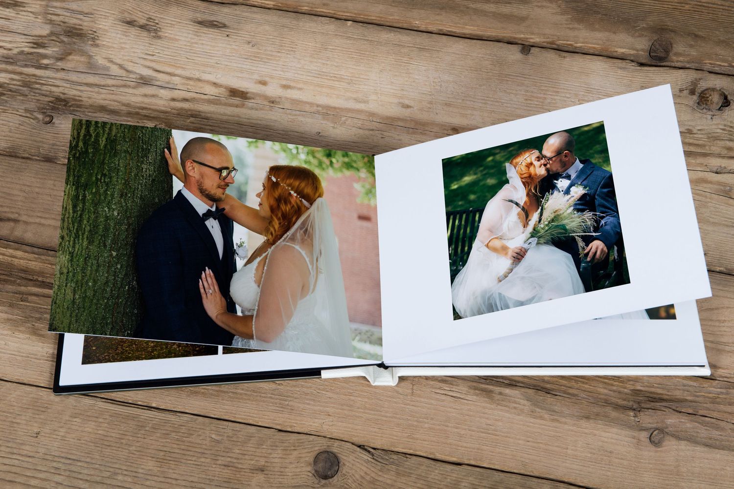Professional wedding photo album layout with multiple photos on wooden background.