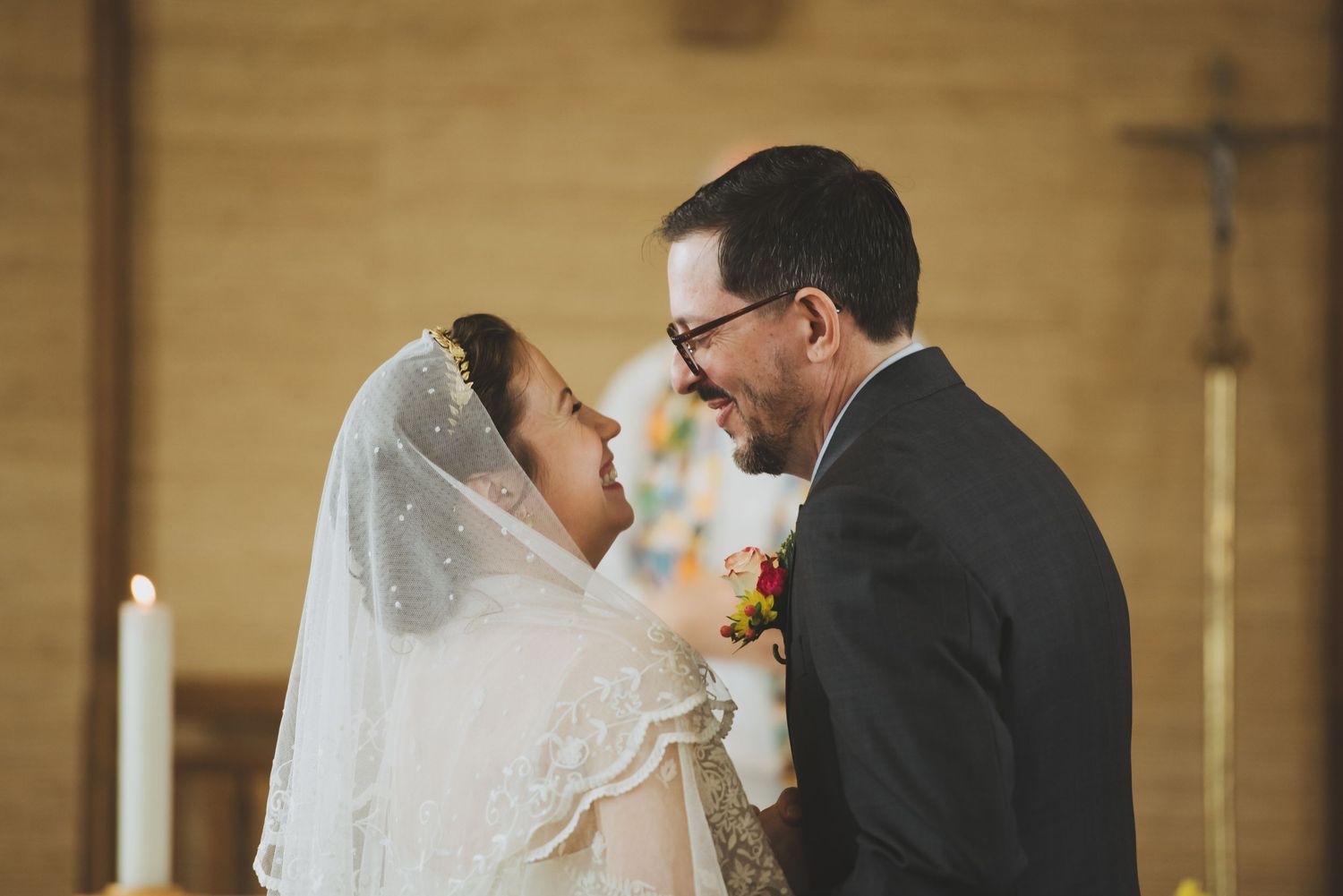 Intimate moment between newlyweds during their church wedding ceremony.