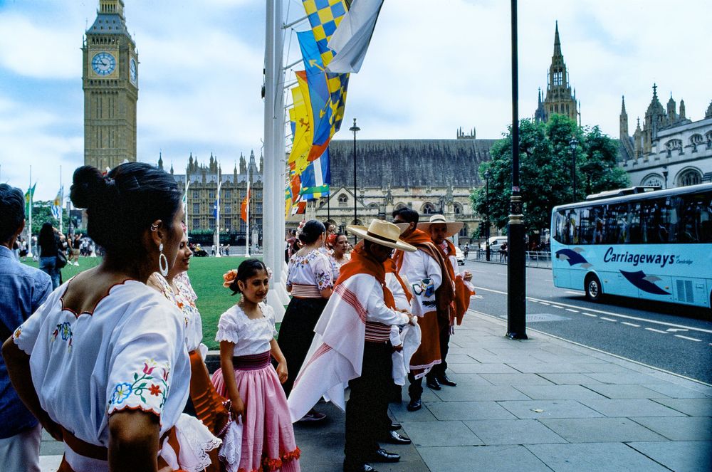 Tourist group gathered near Big Ben and Houses of Parliament in London.