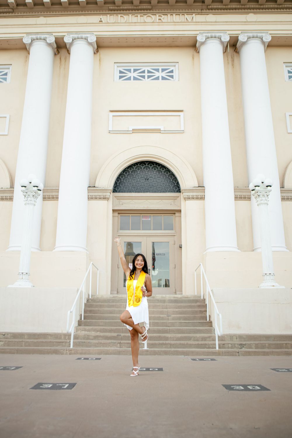 Series of photos showing person in yellow dress walking in front of classical building with white columns.