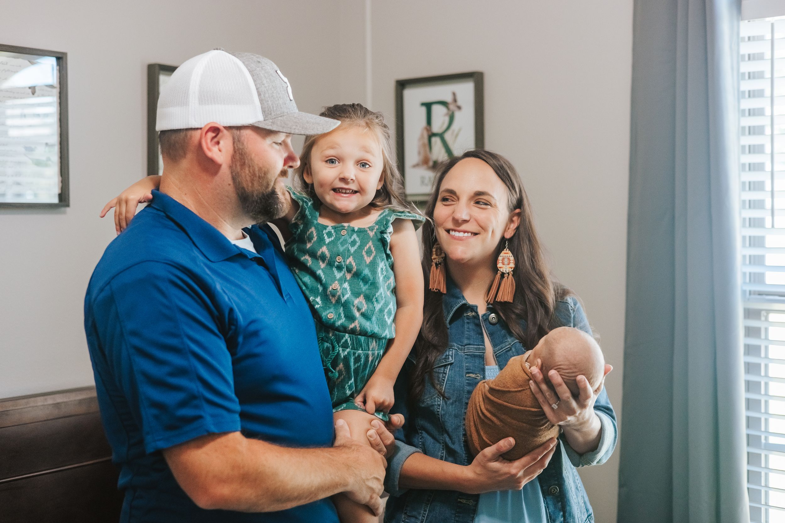 Family lifestyle session showing playful moments in a modern home setting.