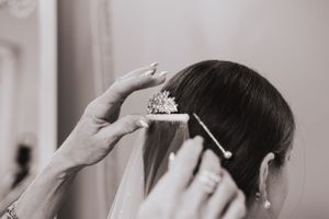 Wedding preparation sequence showing hair and makeup styling details.