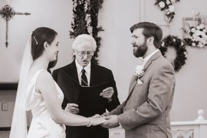 Black and white ceremony moments captured during traditional church wedding.
