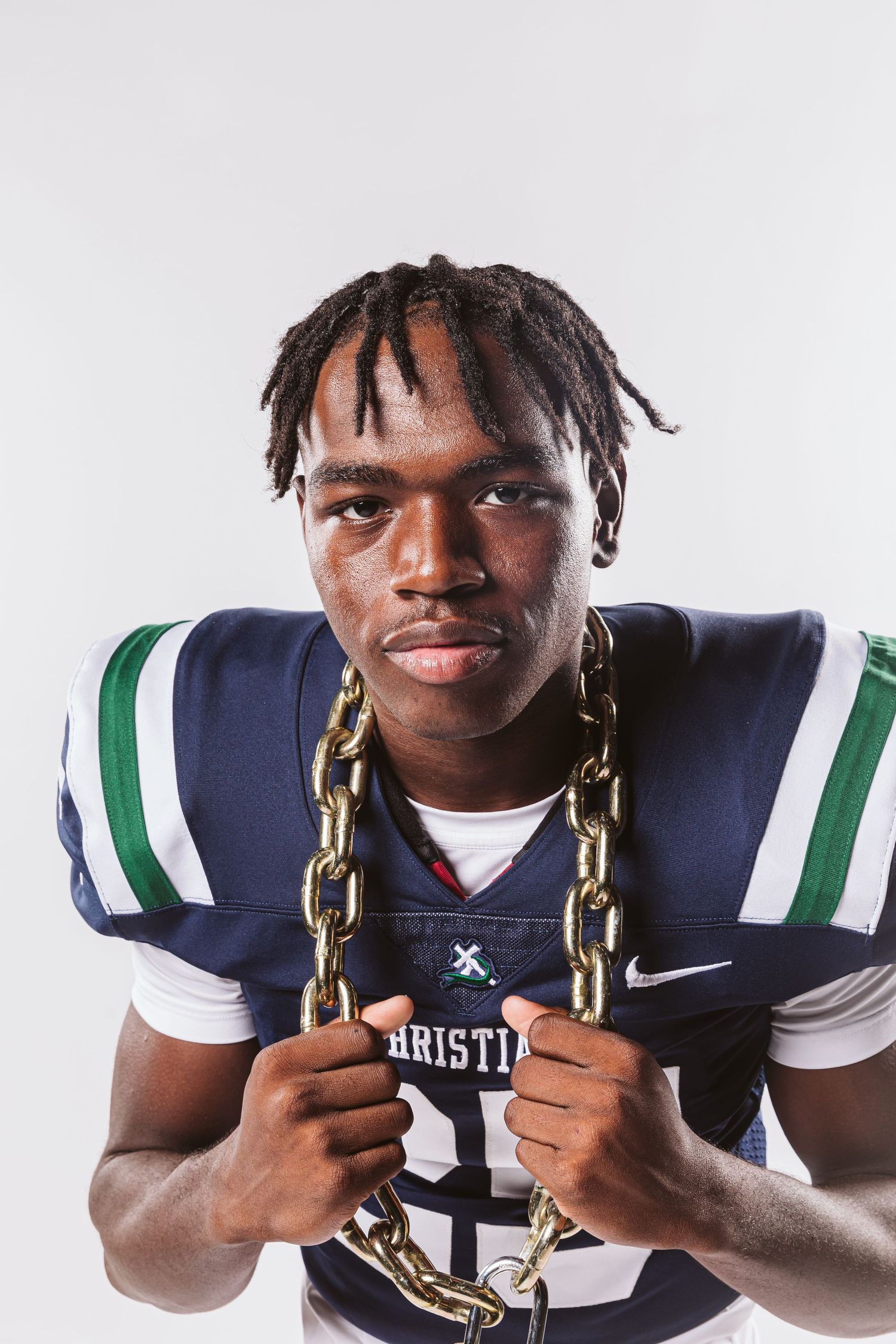 football player holding chain