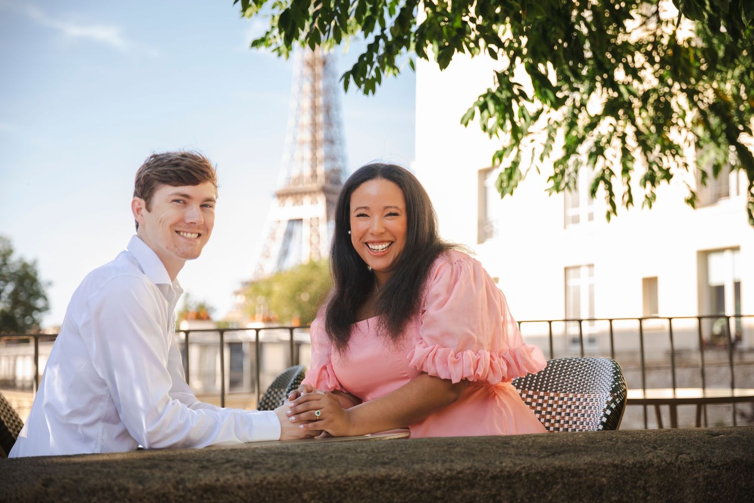 Couple in front of Eiffel Tower in Paris
