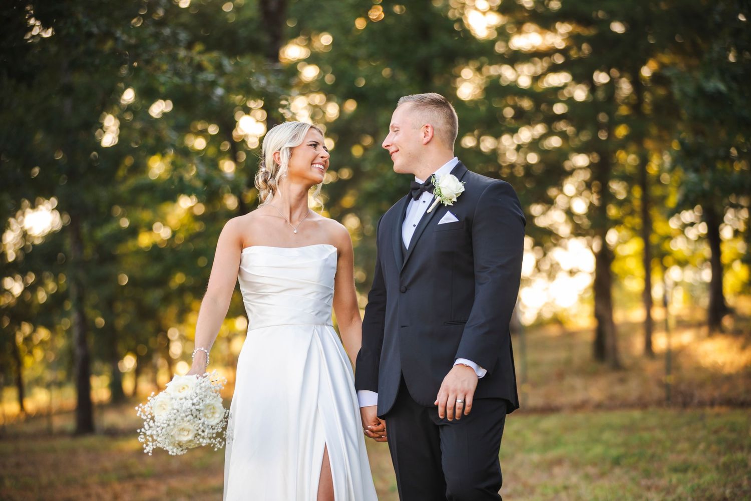 bride and groom holding hands and walking