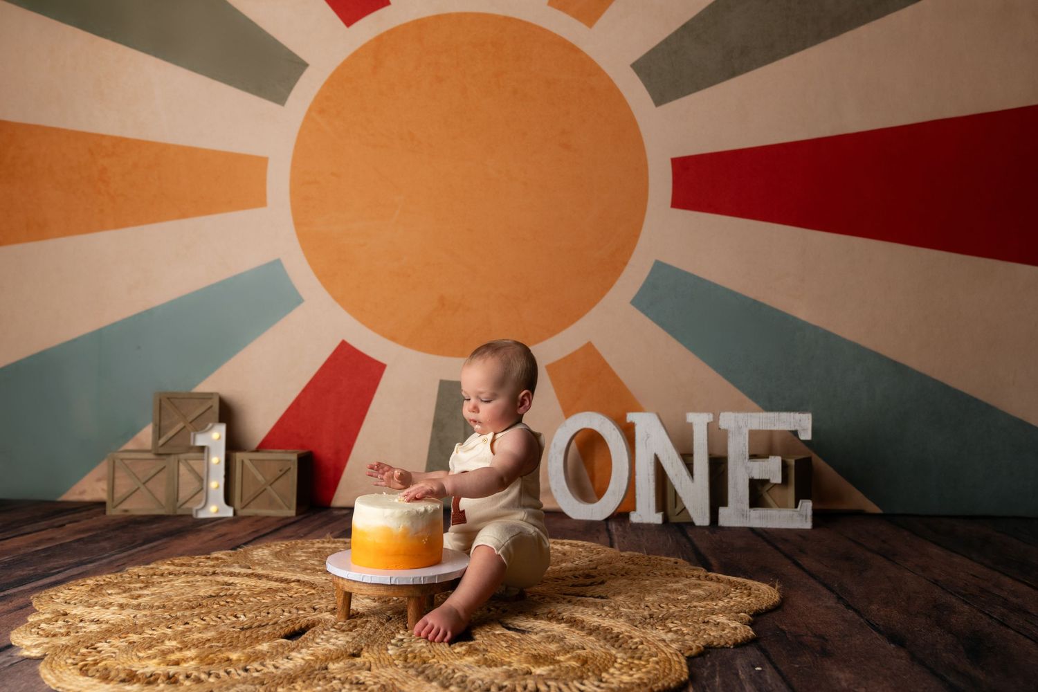 1st Trip around the sun. 1st birthday cake smash session in a Bothell, WA studio. birthday photography by Filling the Frame Photography