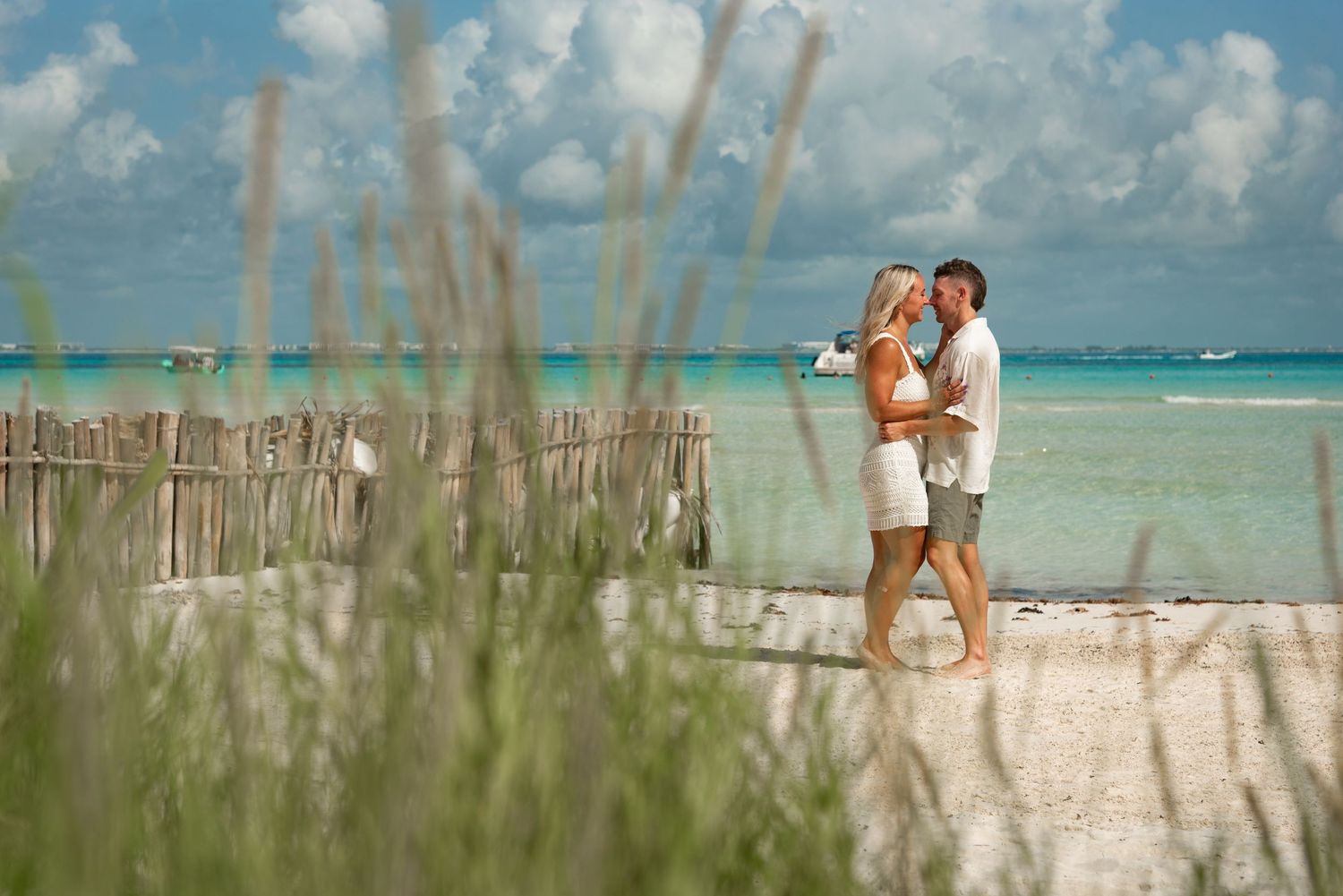 Full Body Portrait of a couple standing and almost kissing during their photoshoot in Isla Mujeres