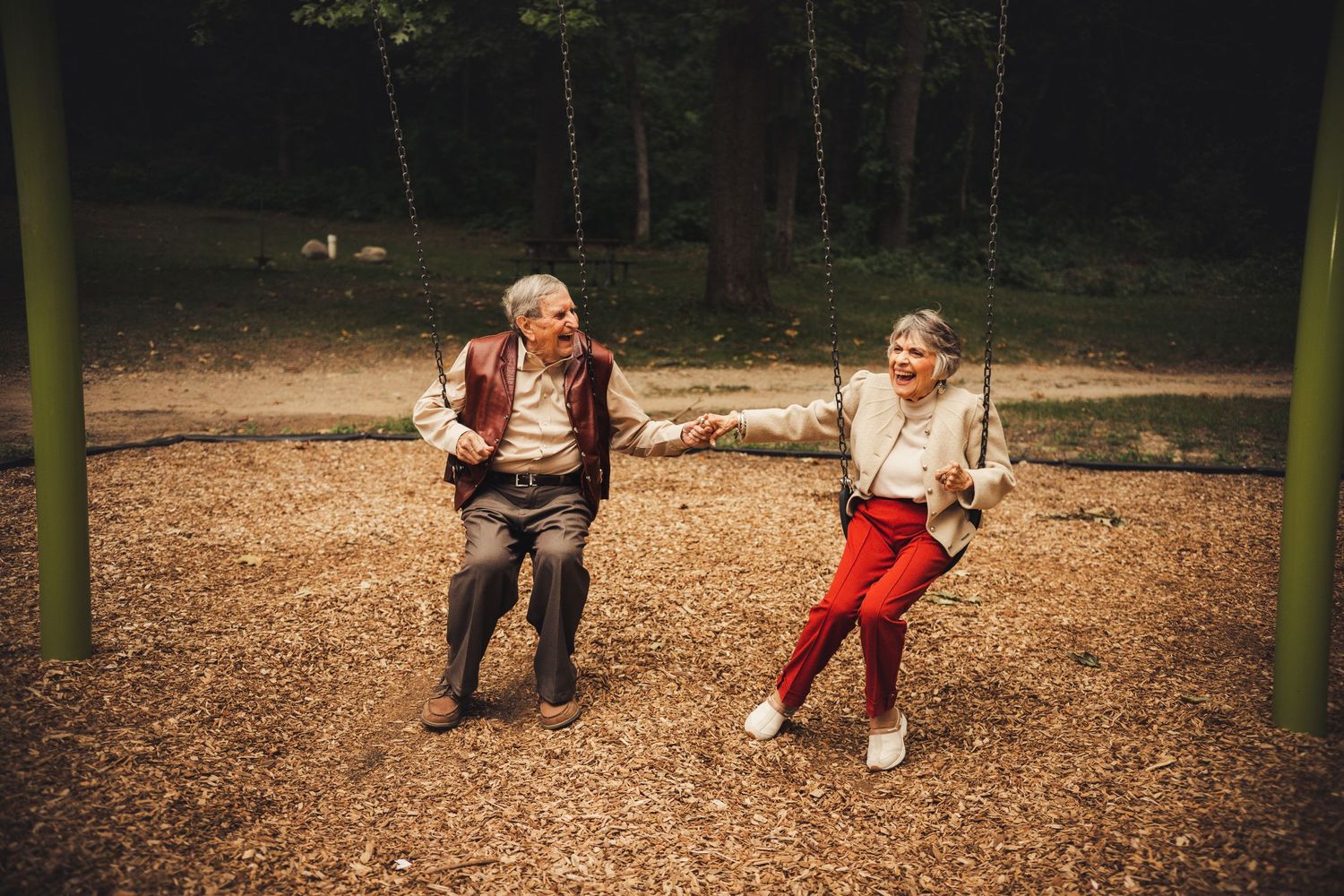 A fun couples portrait  on the swings in Kensington Metro Park