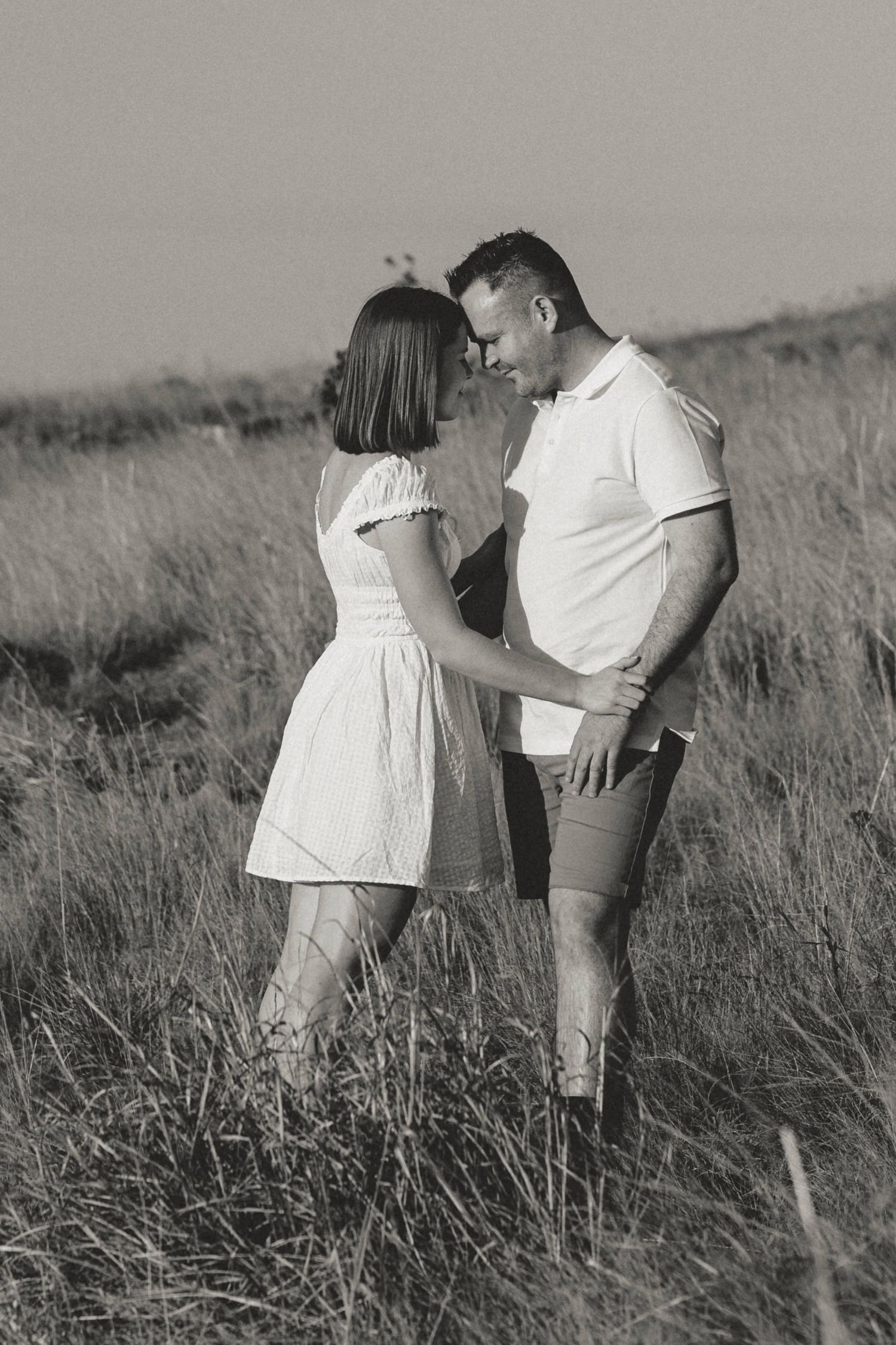bride and groom walking in street