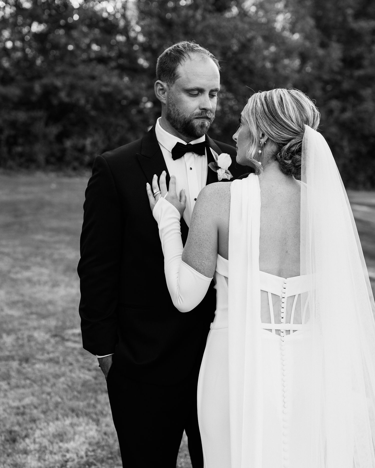 black and white photo during a bridal session after a wedding ceremony
