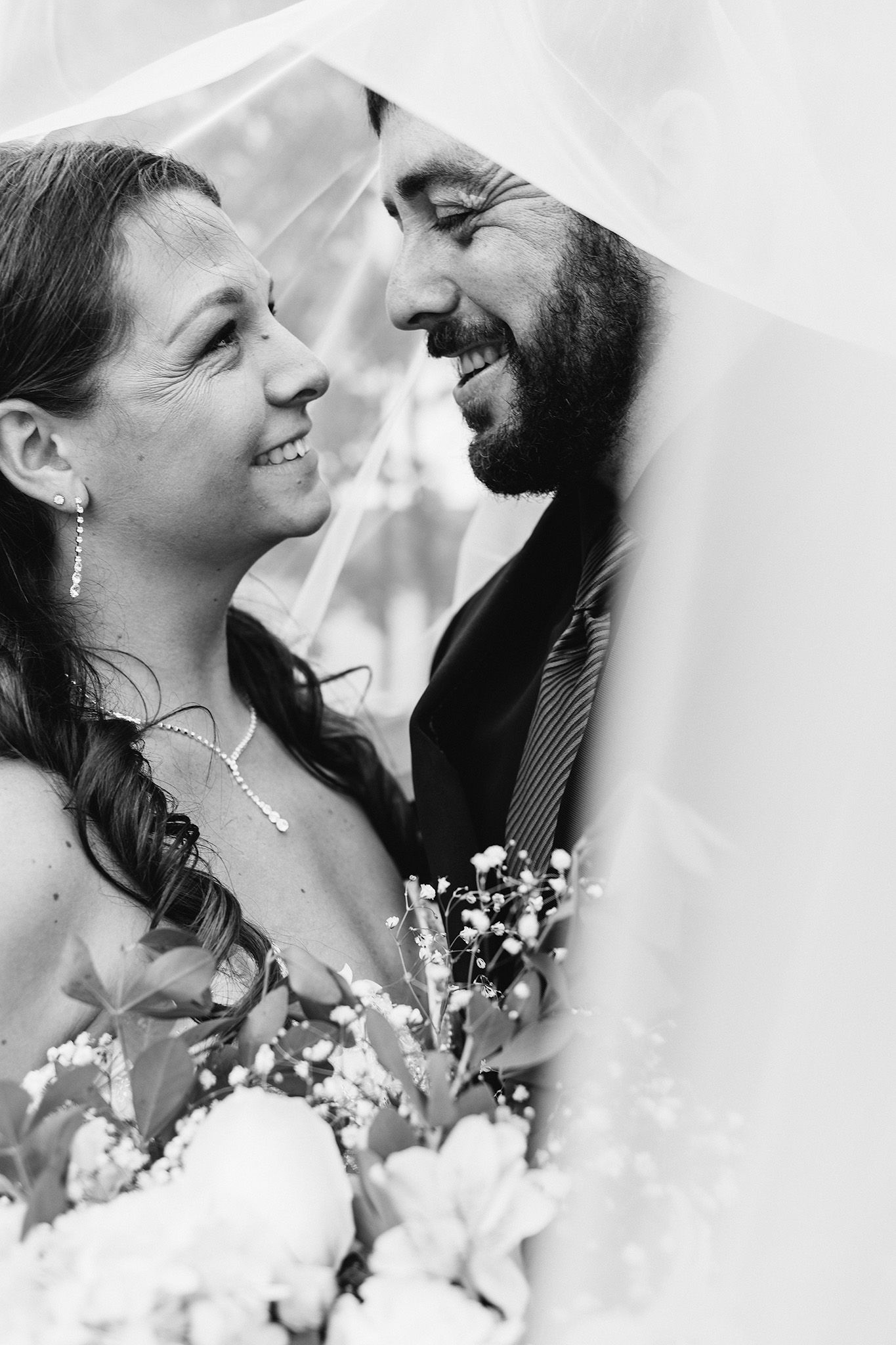 maine wedding photographer capturing lakeside ceremony at maine wedding venue with photos of bridal couple