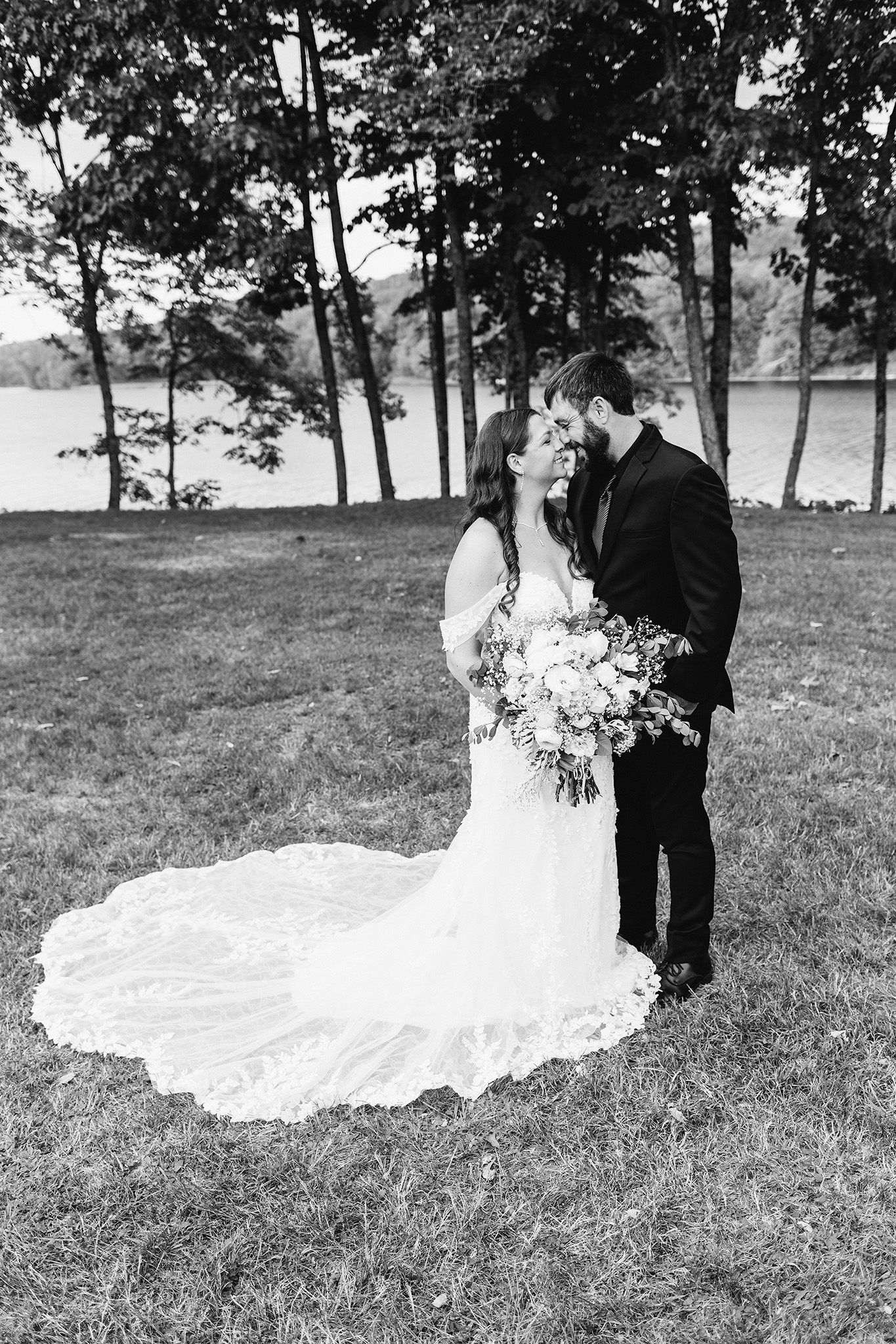 maine wedding photographer capturing lakeside ceremony at maine wedding venue with photos of bridal couple