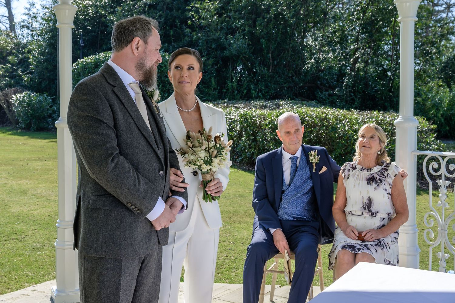 Bride and groom during outdoor ceremony at Storrs hall Hotel in the Lake District