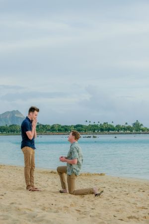 Man proposing on beach in Hawaii