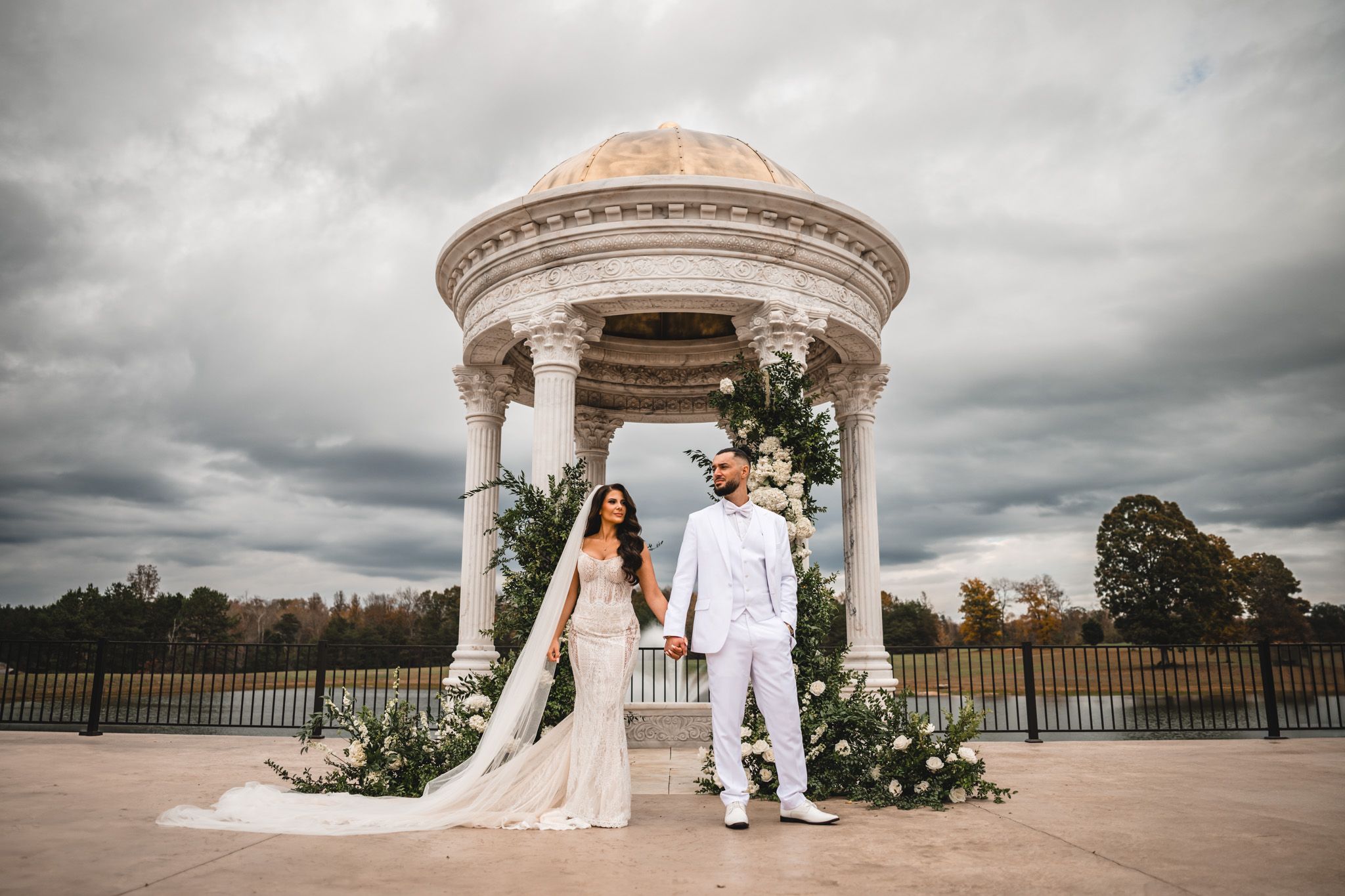 stoic elegant newlywed portrait  of the bride and groom at the gazebo at The conservatory at blackberry ridge