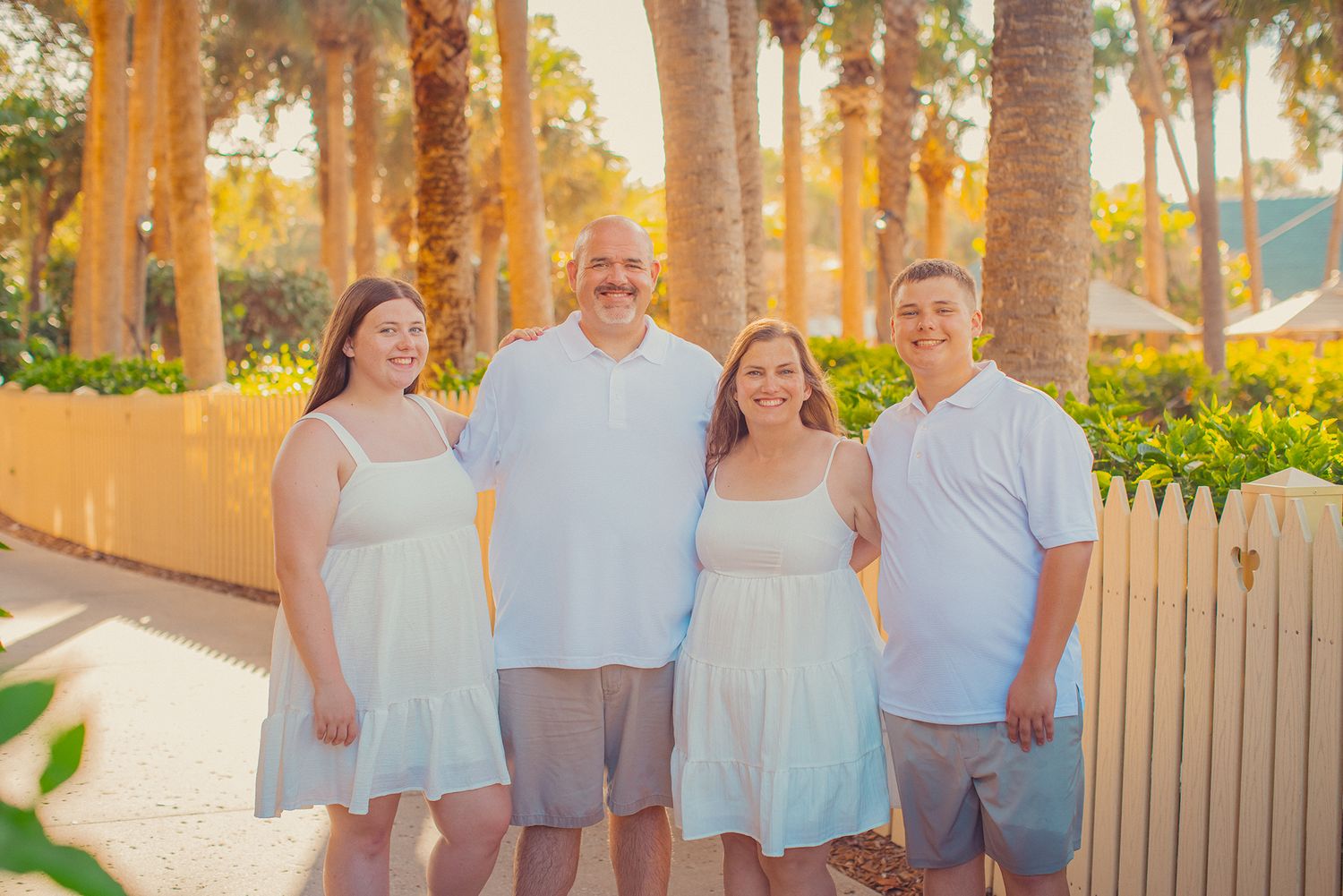 Family pictures at Disney's Vero Beach resort are the perfect wasy to pause the moment, even on the sidewalk next to a Mickey Mouse cutout!