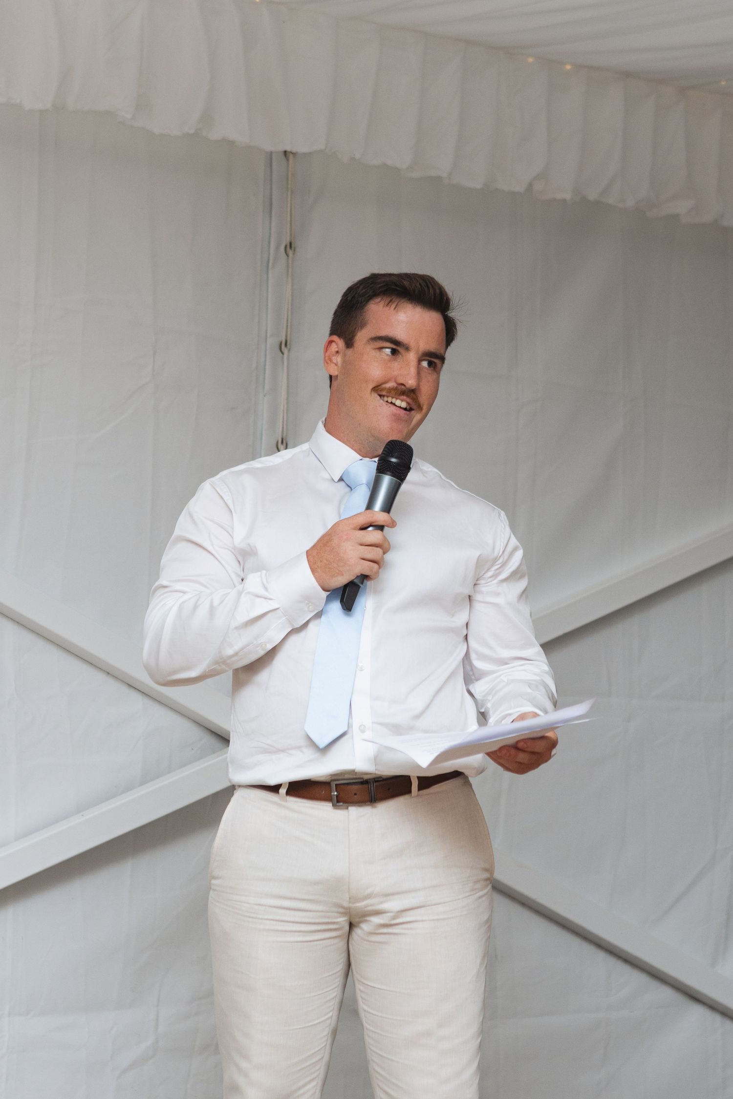 Best man laughing during speech at reception at Two Rivers Winery Wedding in Denman