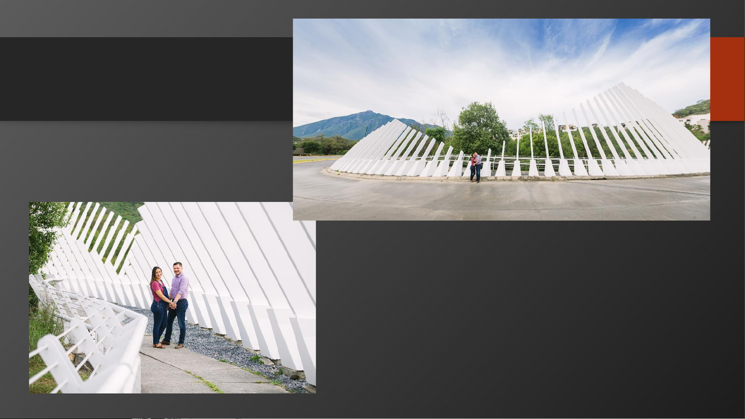 Couple posing near a modern white architectural structure with mountain views under a bright blue sky.