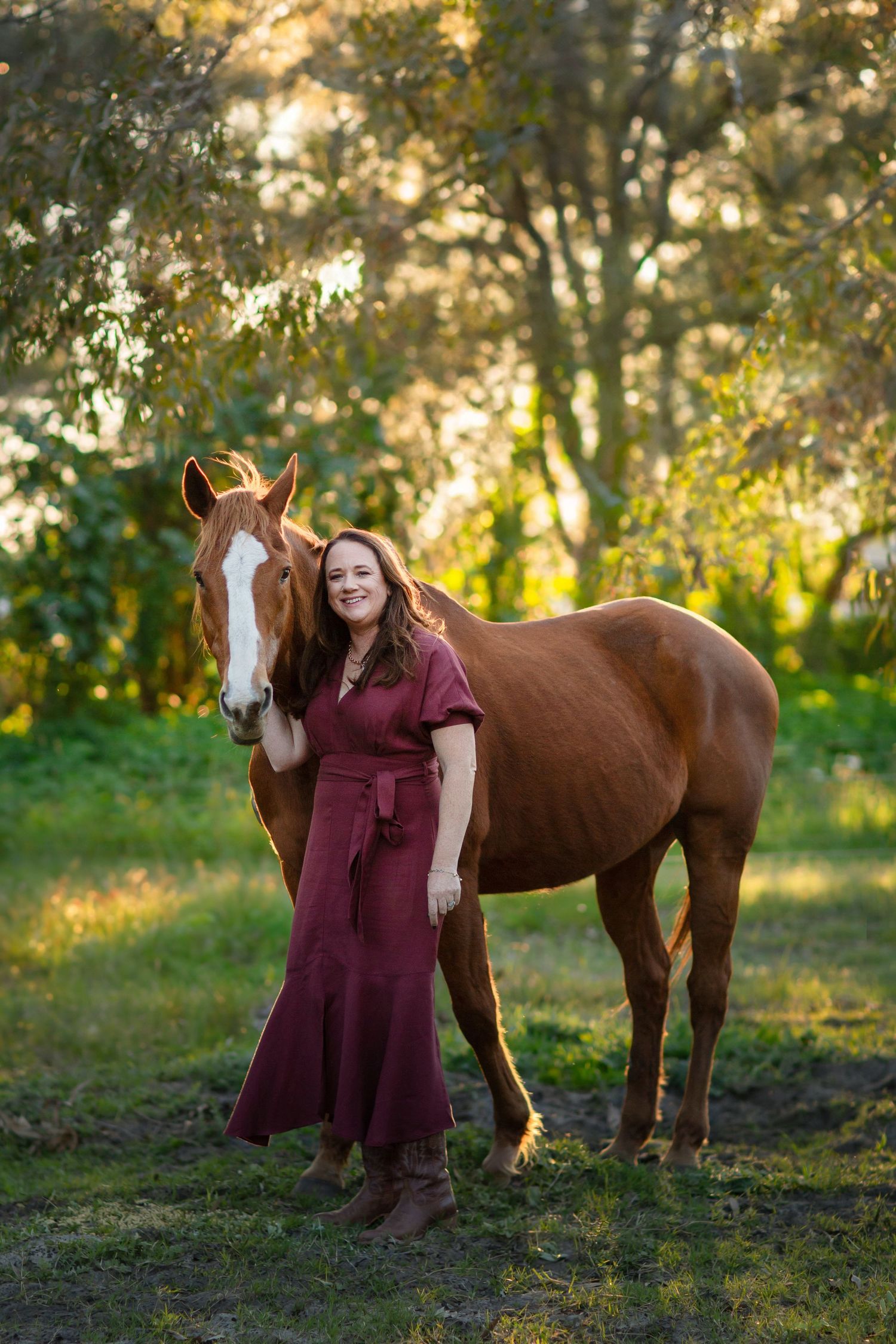 Chestnut horse and owner having a photo session during golden hour at a rural property in Perth