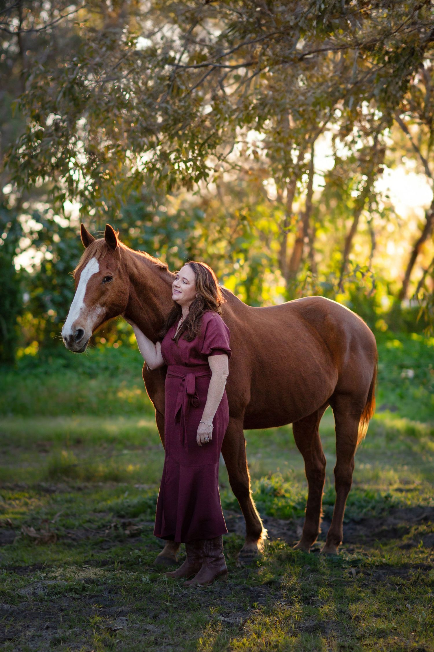 Chestnut horse and owner having a photo session during golden hour at a rural property in Perth