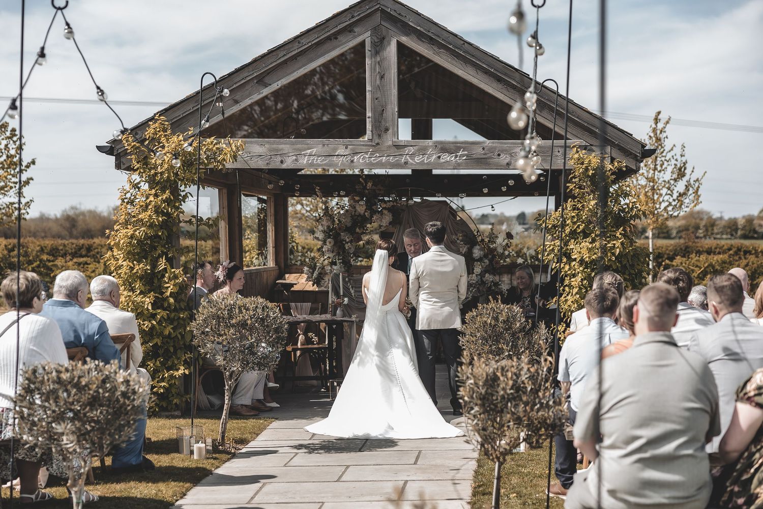 Wide view of registrar wedding of couple and guests