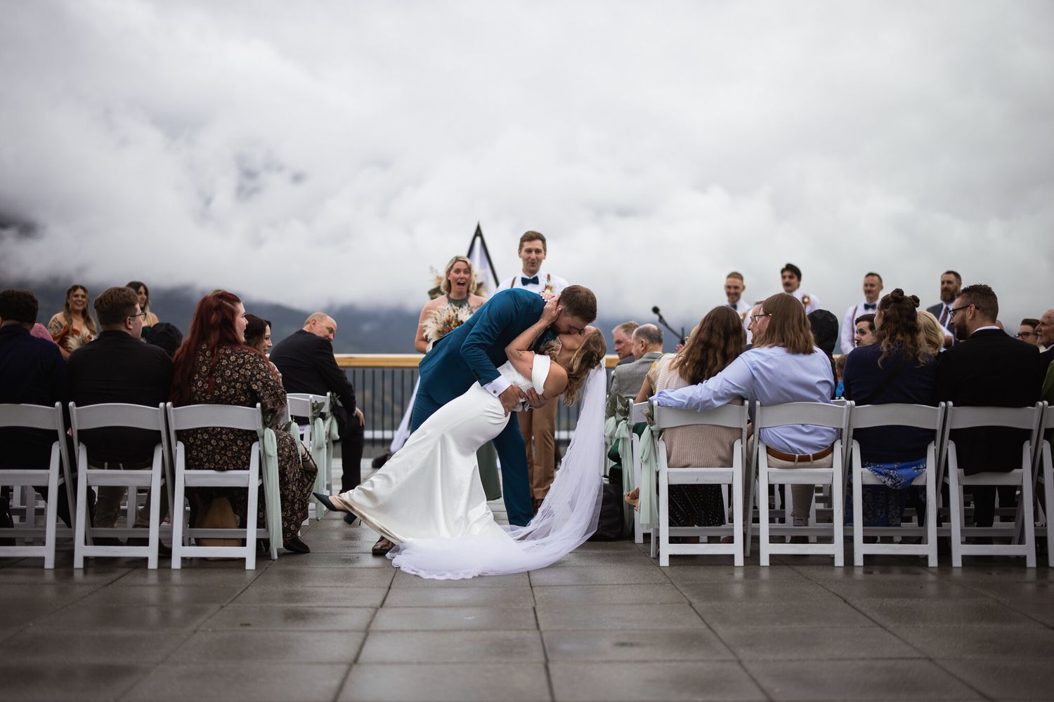 Groom dips bride for the first kiss at The Vista with Cornerstone Weddings in Canmore